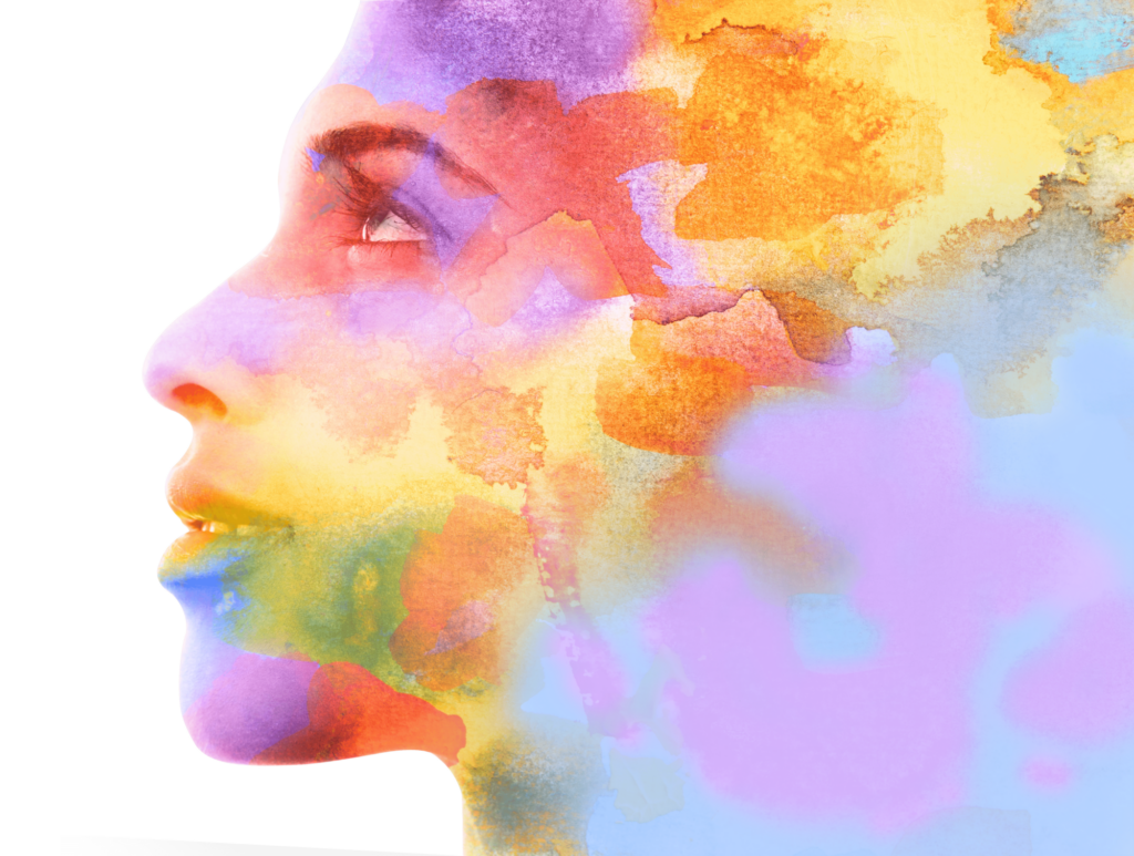 A woman's face emerges from a colorful collage of watercolor splotches.